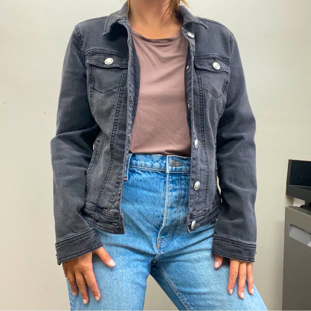 Black denim jacket sized medium stretchy and comfortable NOT rigid or heavy